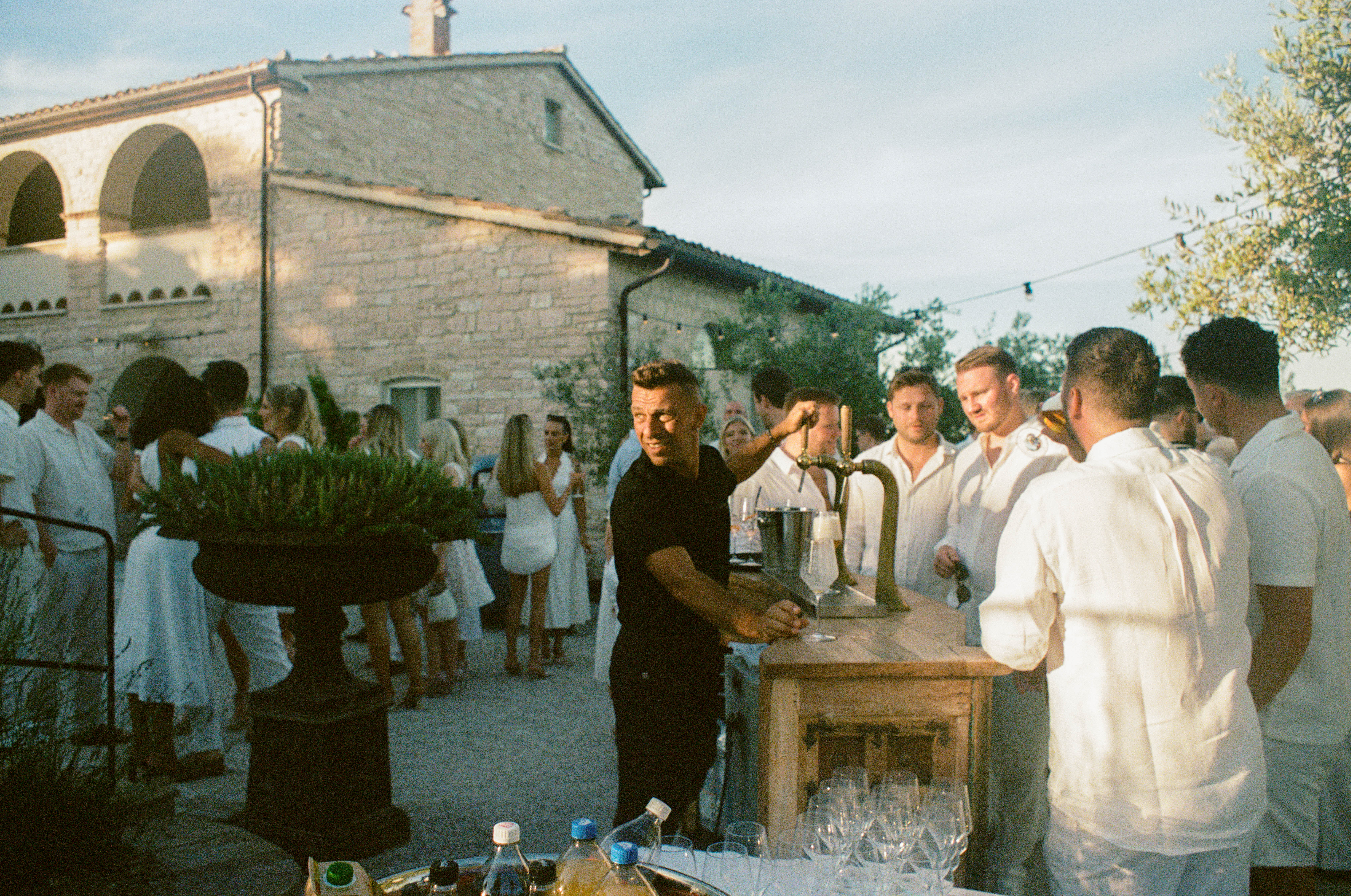 Candid snapshot bartender pouring layout, Italy